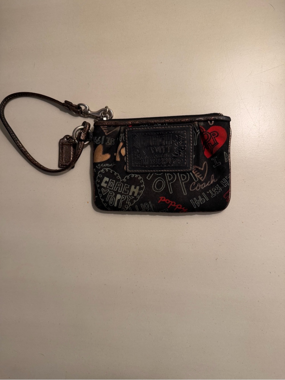Coach Black Wristlet with Red and Cream Heart Accents